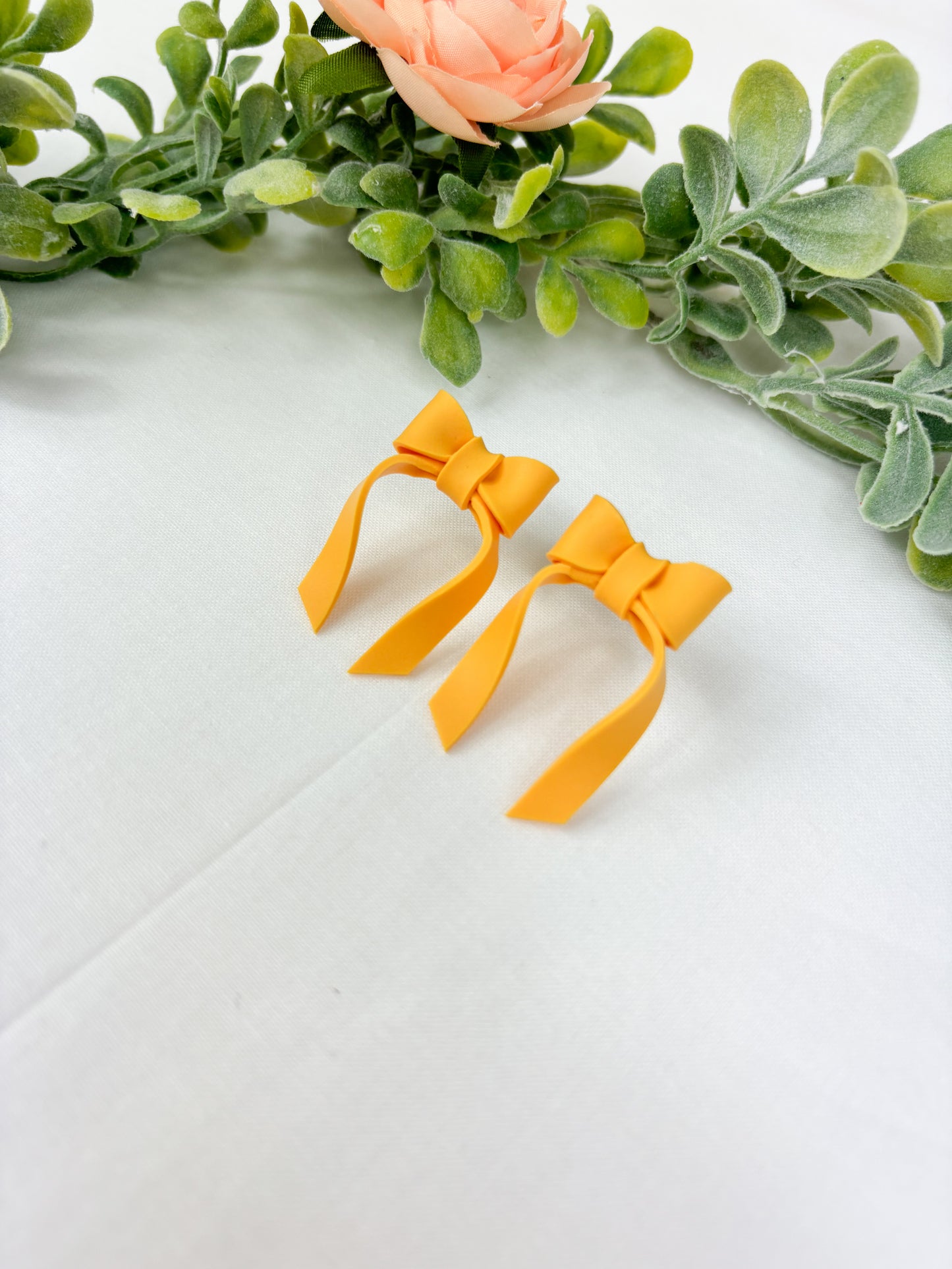 Mustard yellow bow studs