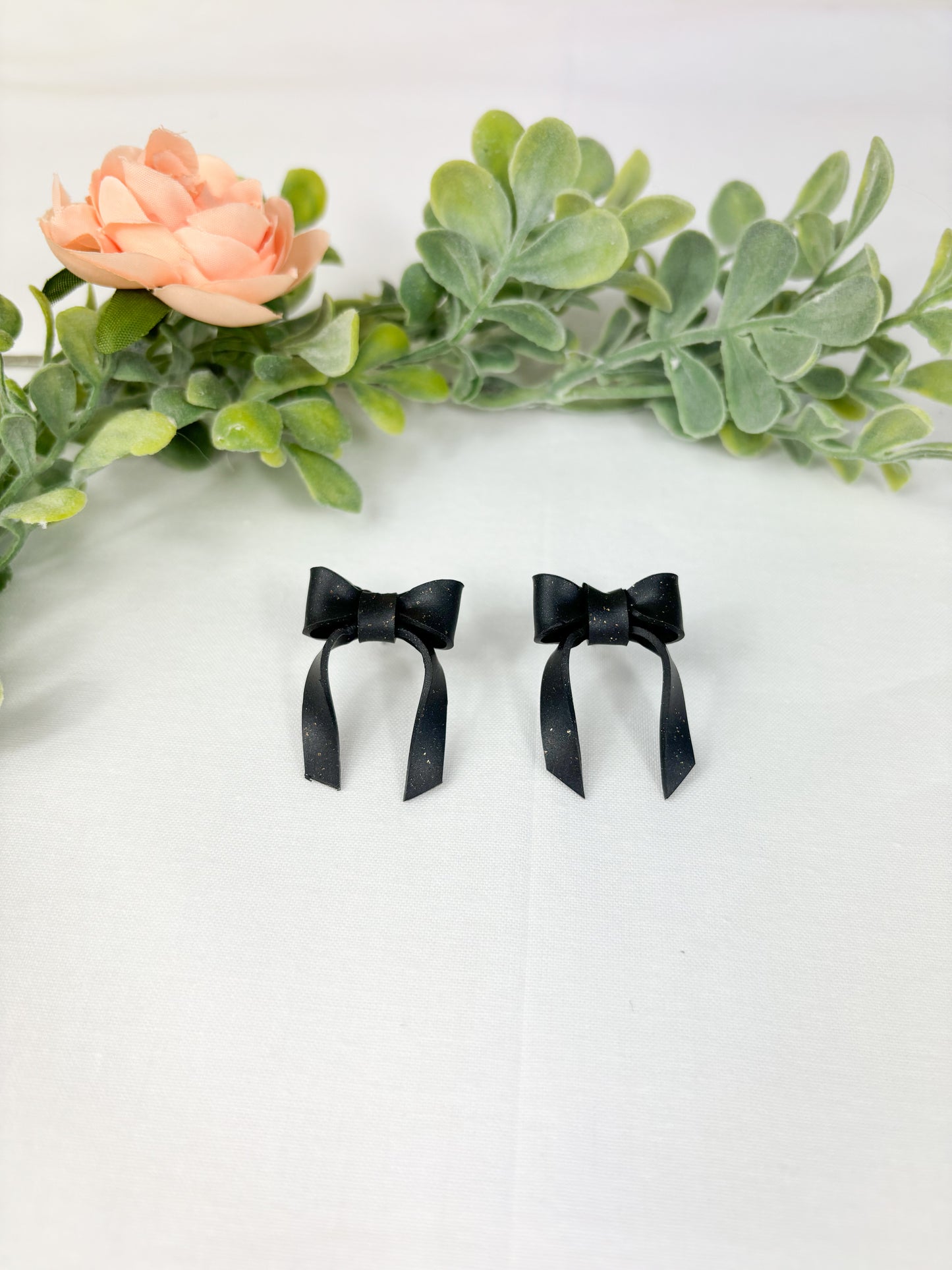 Black bow studs