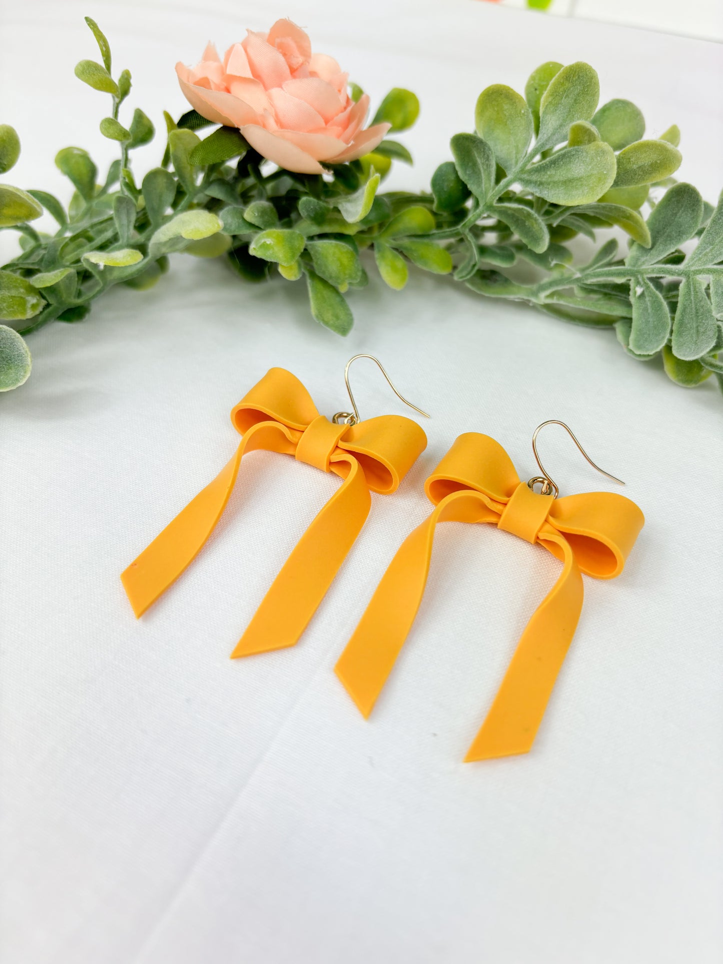 Mustard bow dangles