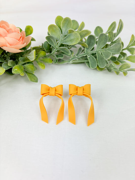 Mustard yellow bow studs