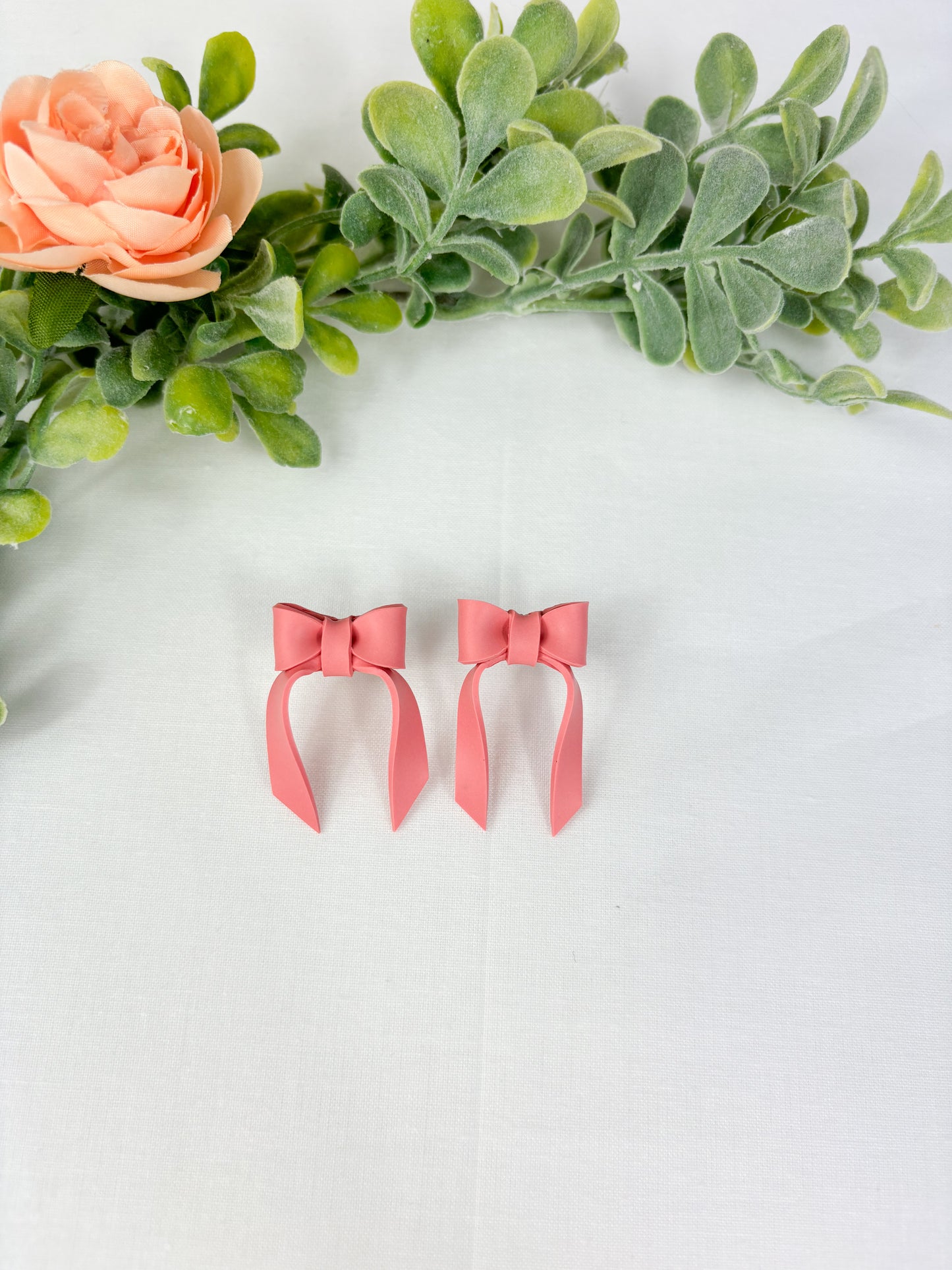 Blush pink bow studs