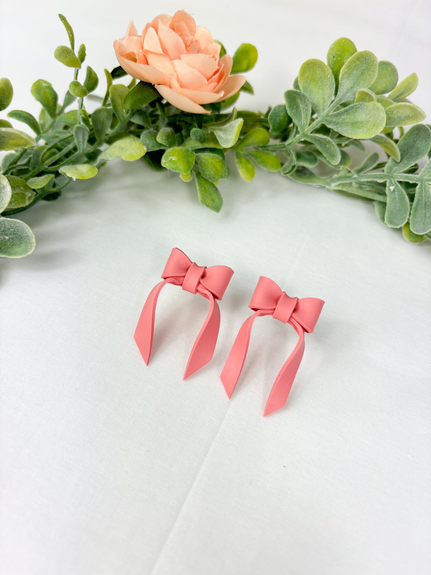 Blush pink bow studs